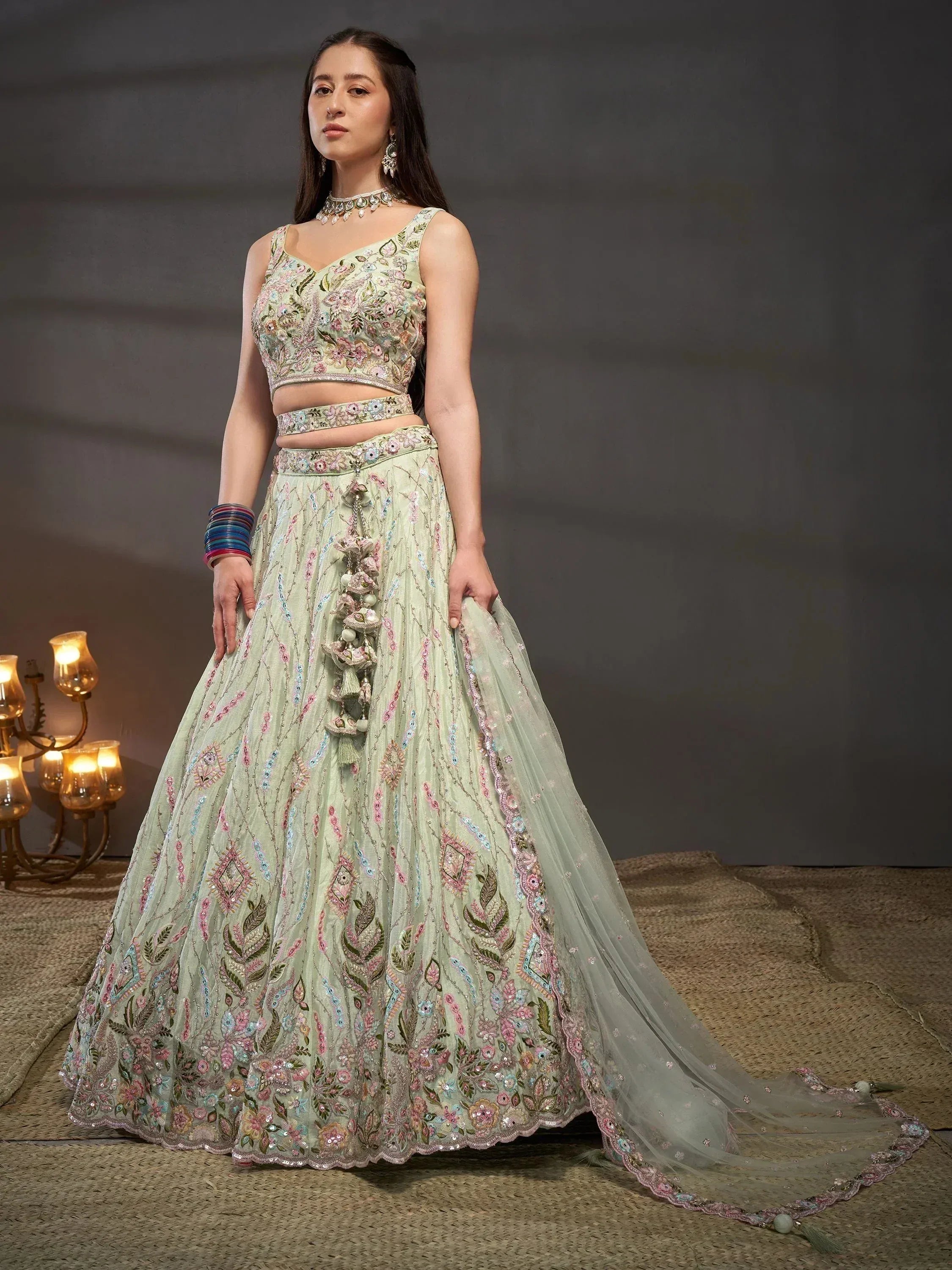 Mint green embroidered lehenga choli with floral motifs, perfect for Indian ethnic wear and festive occasions.