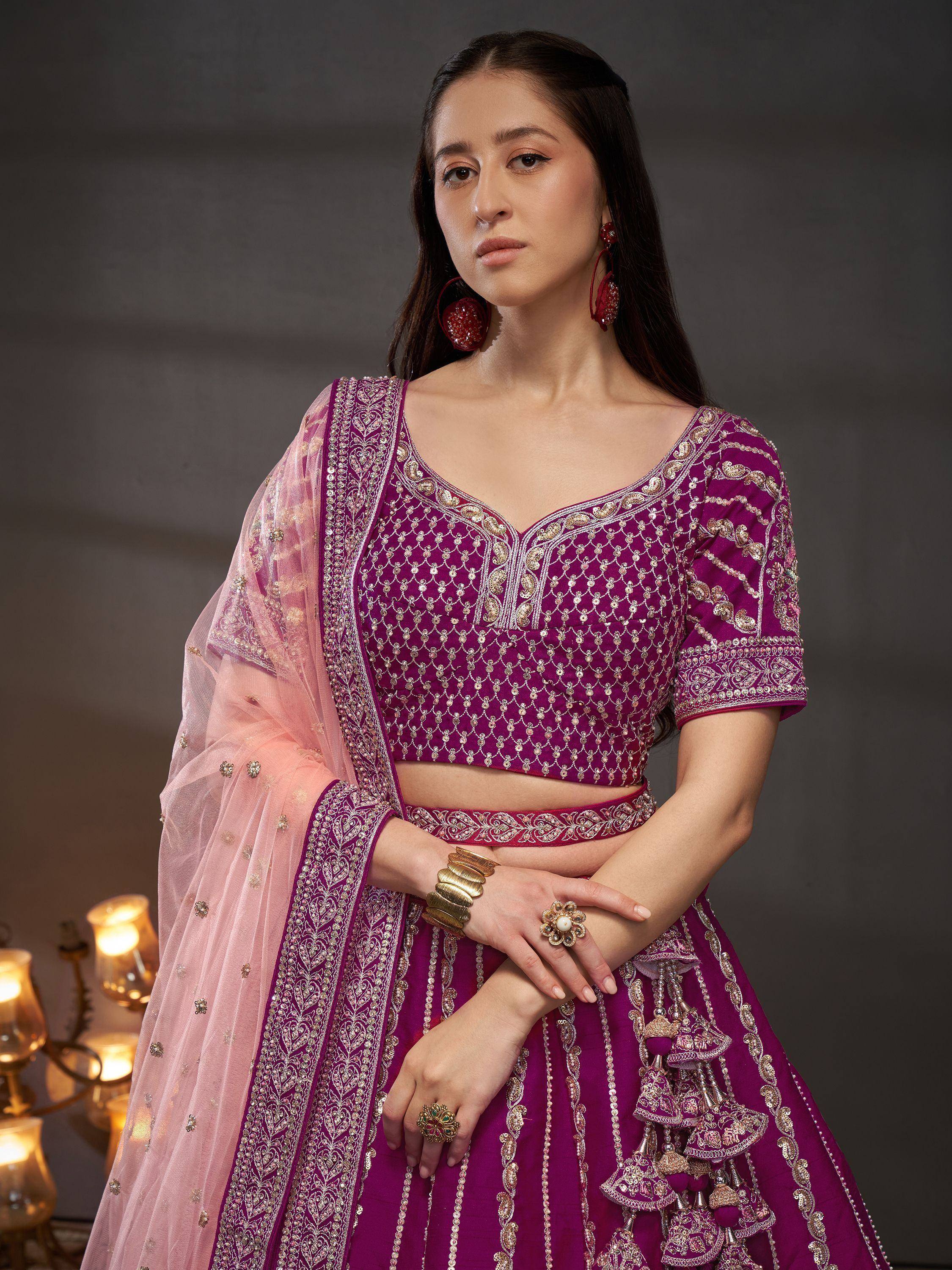 Purple embroidered lehenga choli with pink dupatta, perfect for Indian ethnic wear and festive occasions.
