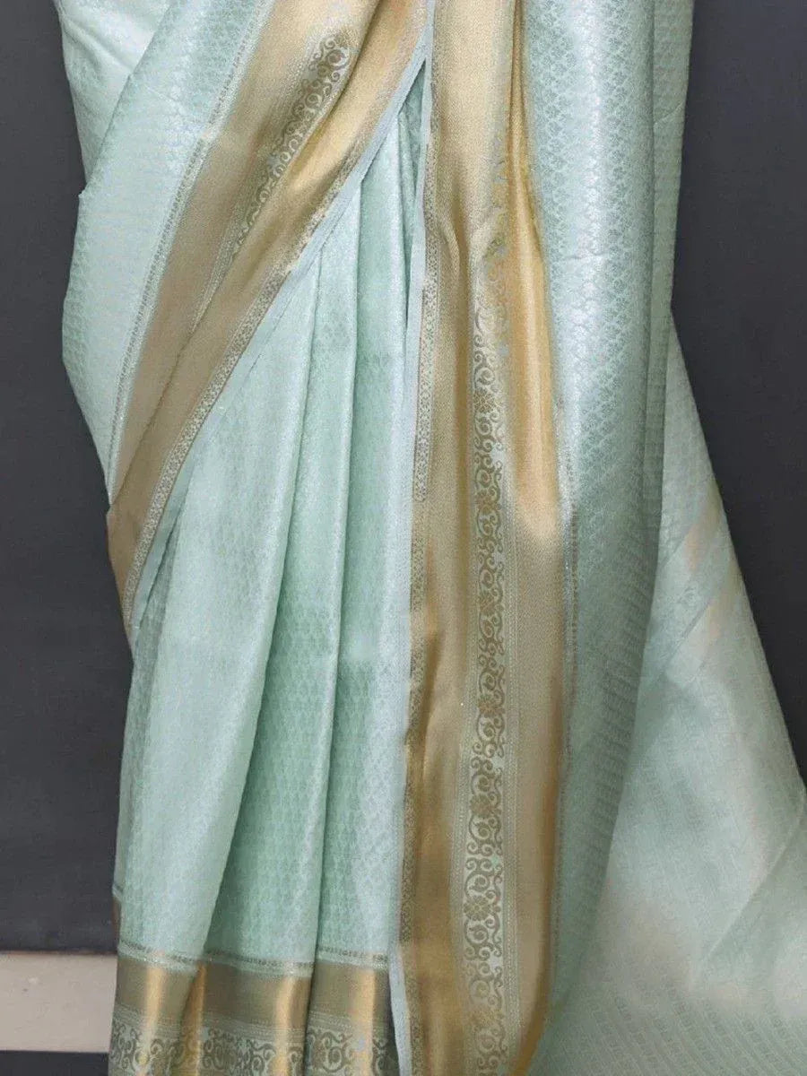 Mint green saree with gold zari border, elegant Indian ethnic wear for women