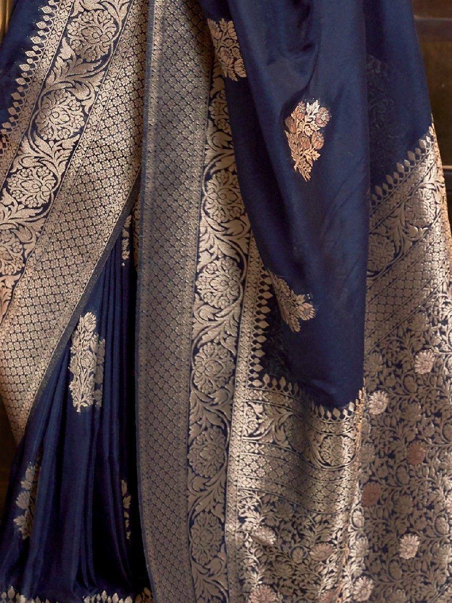 Navy blue silk saree with gold floral zari work and intricate border design