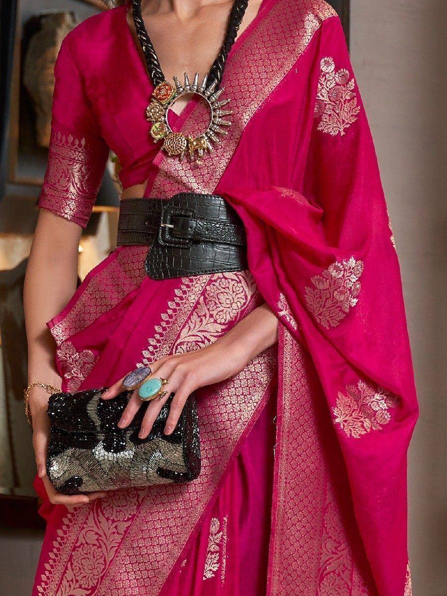 Fuchsia pink designer saree with gold embroidery, statement necklace, and black belt for ethnic wear