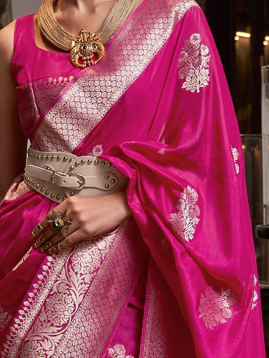 Pink designer saree with gold embroidery, statement belt, and traditional jewelry for ethnic wear