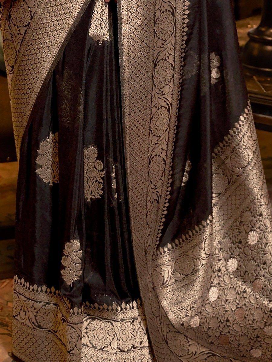 Black and gold embroidered ethnic lehenga choli with intricate floral zari work and velvet fabric