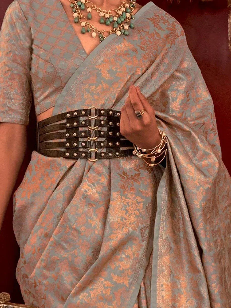 Blue and gold designer saree with statement belt, ethnic jewelry, and blouse for Indian occasions