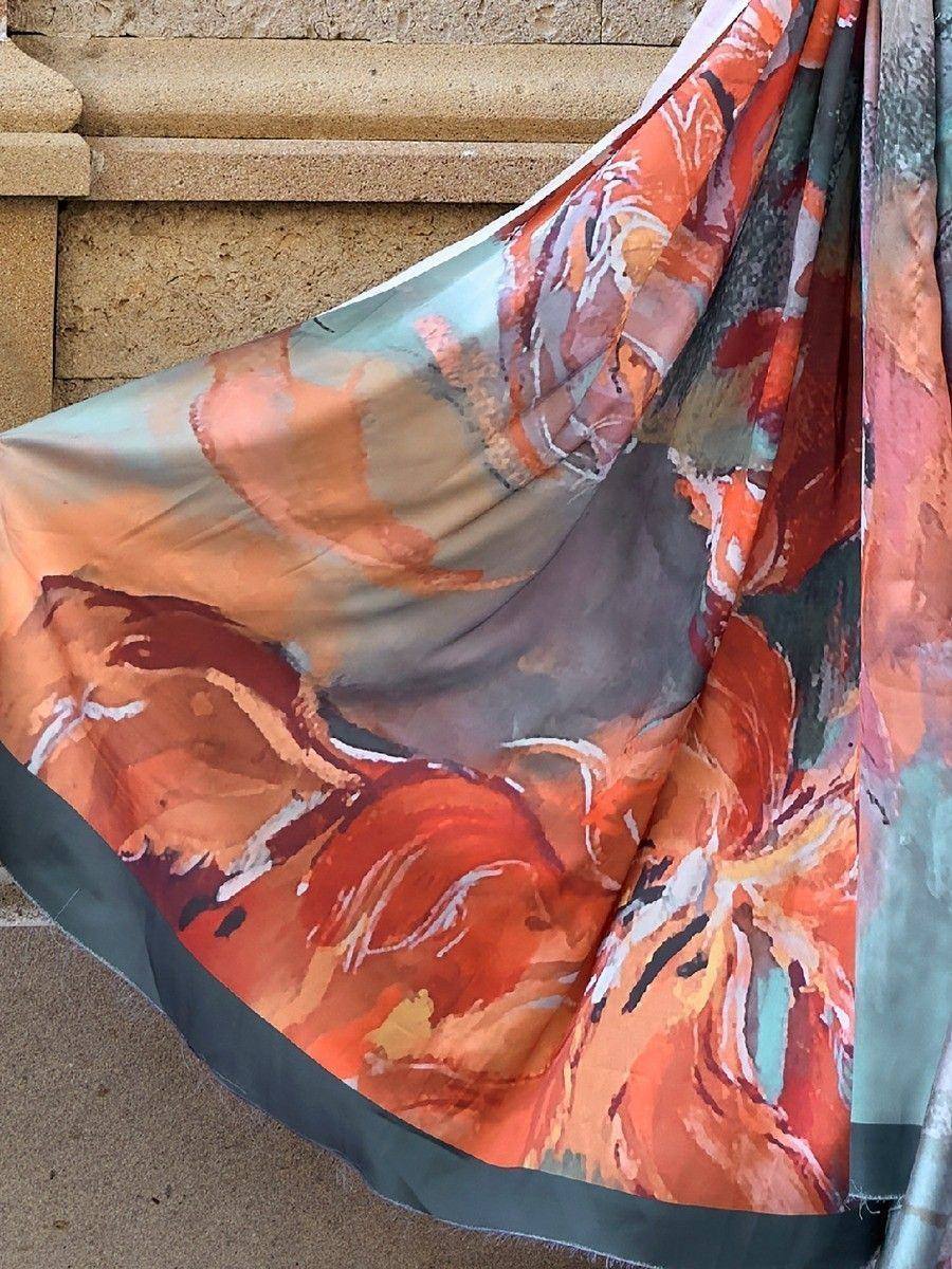 Vibrant abstract floral scarf in orange, teal, and gray, perfect for ethnic wear styling