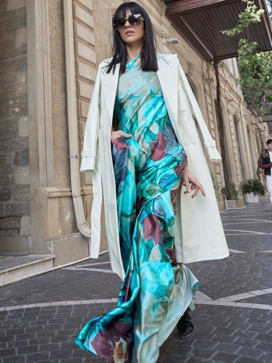 Woman in floral print ethnic gown with cream coat, stylish streetwear for modern Indian fashion
