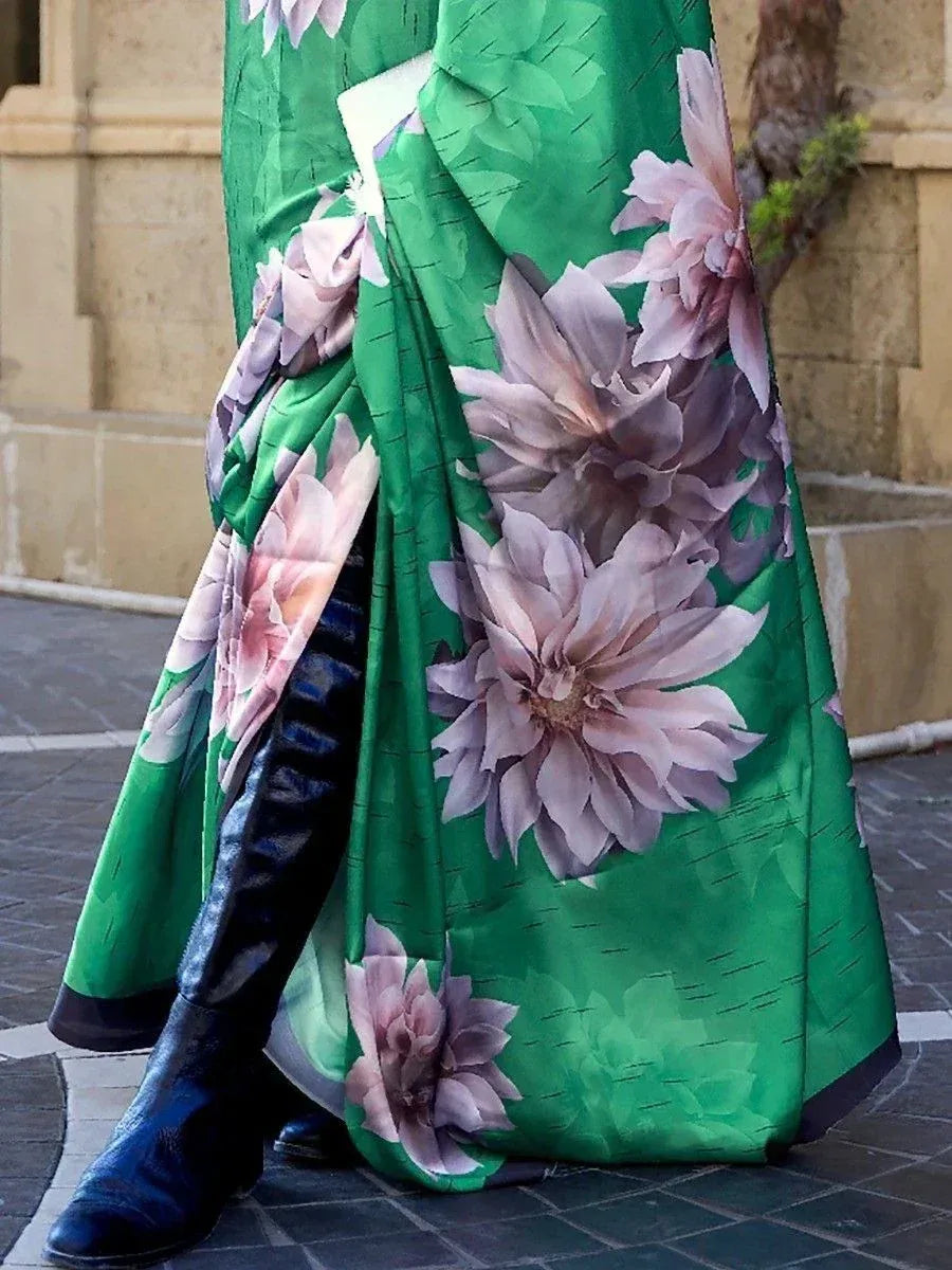 Green floral saree with pink blooms, styled with black boots for modern ethnic look