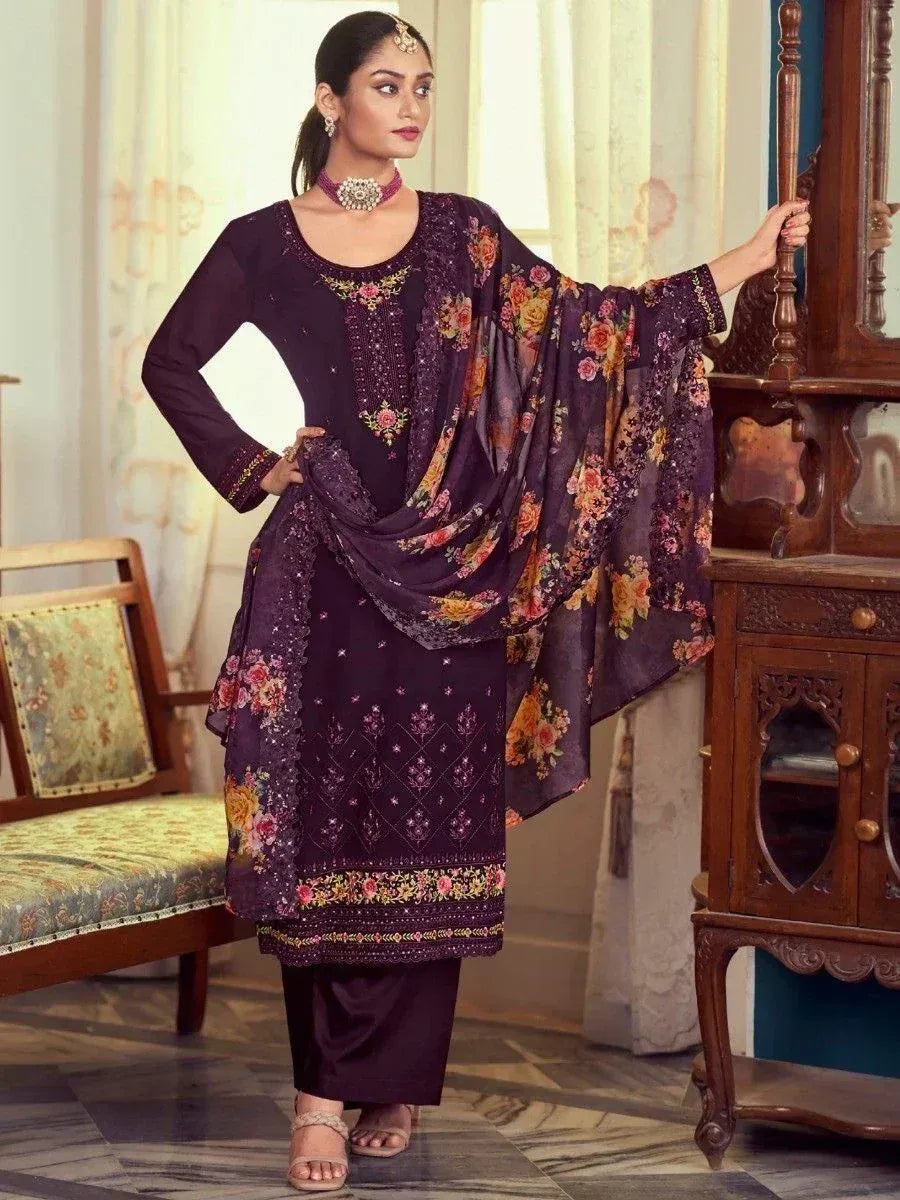 Woman wearing dark purple floral embroidered salwar kameez with matching dupatta