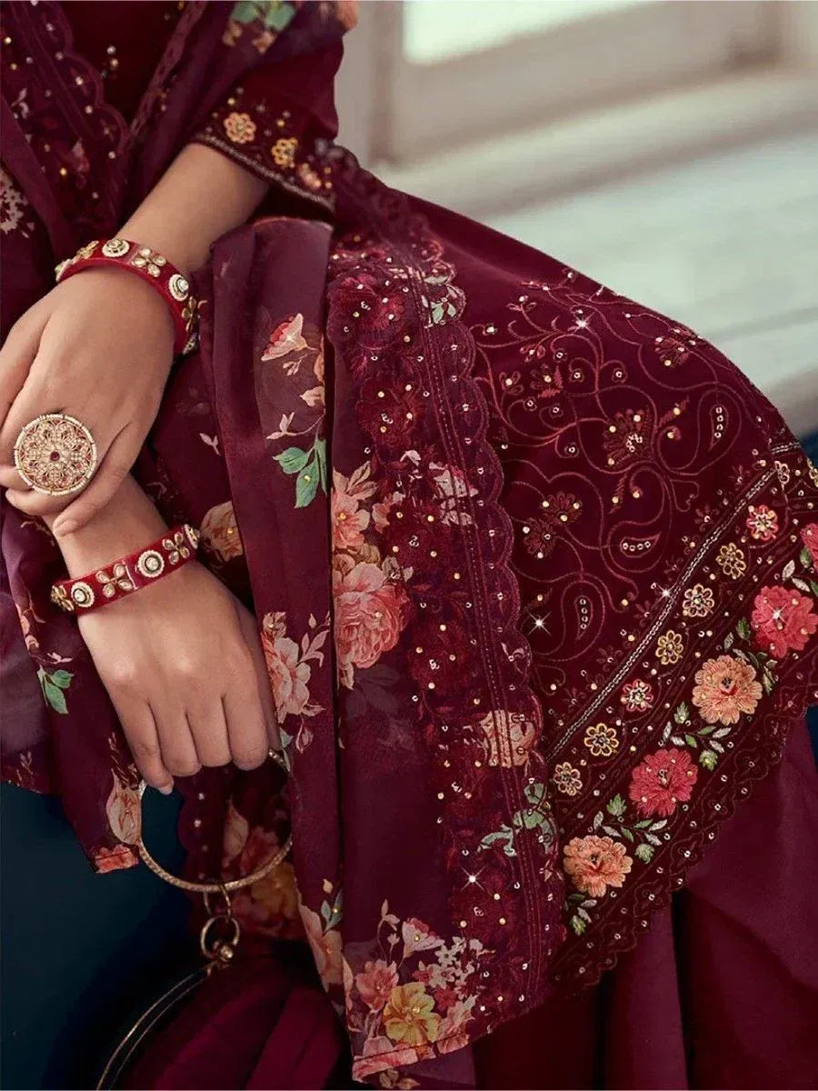 Maroon floral embroidered ethnic dress with matching bangles and statement ring, perfect for festive occasions