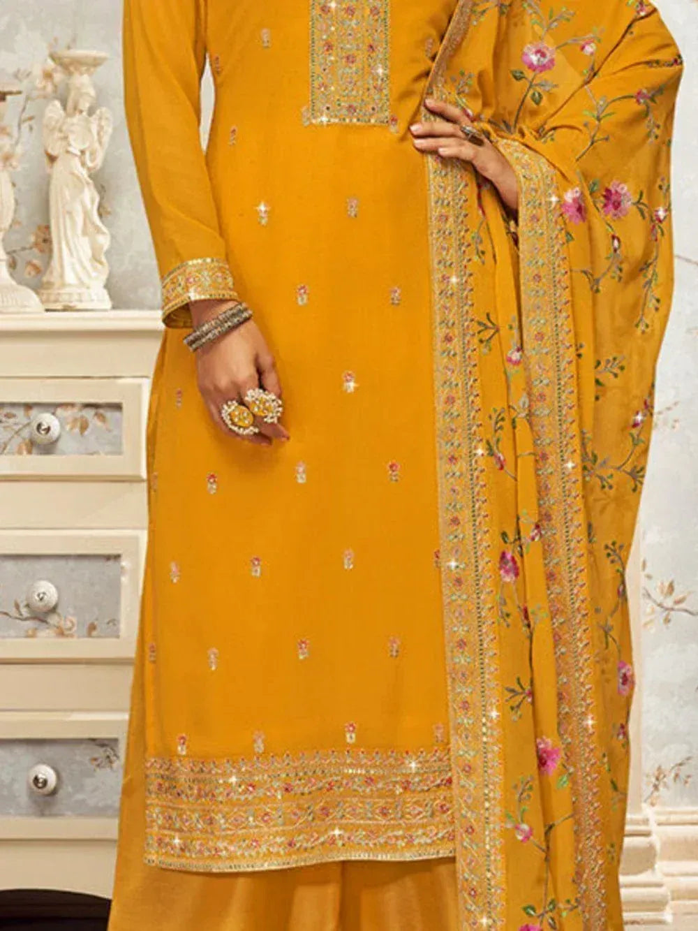 Mustard yellow embroidered salwar kameez with floral dupatta, traditional Indian attire