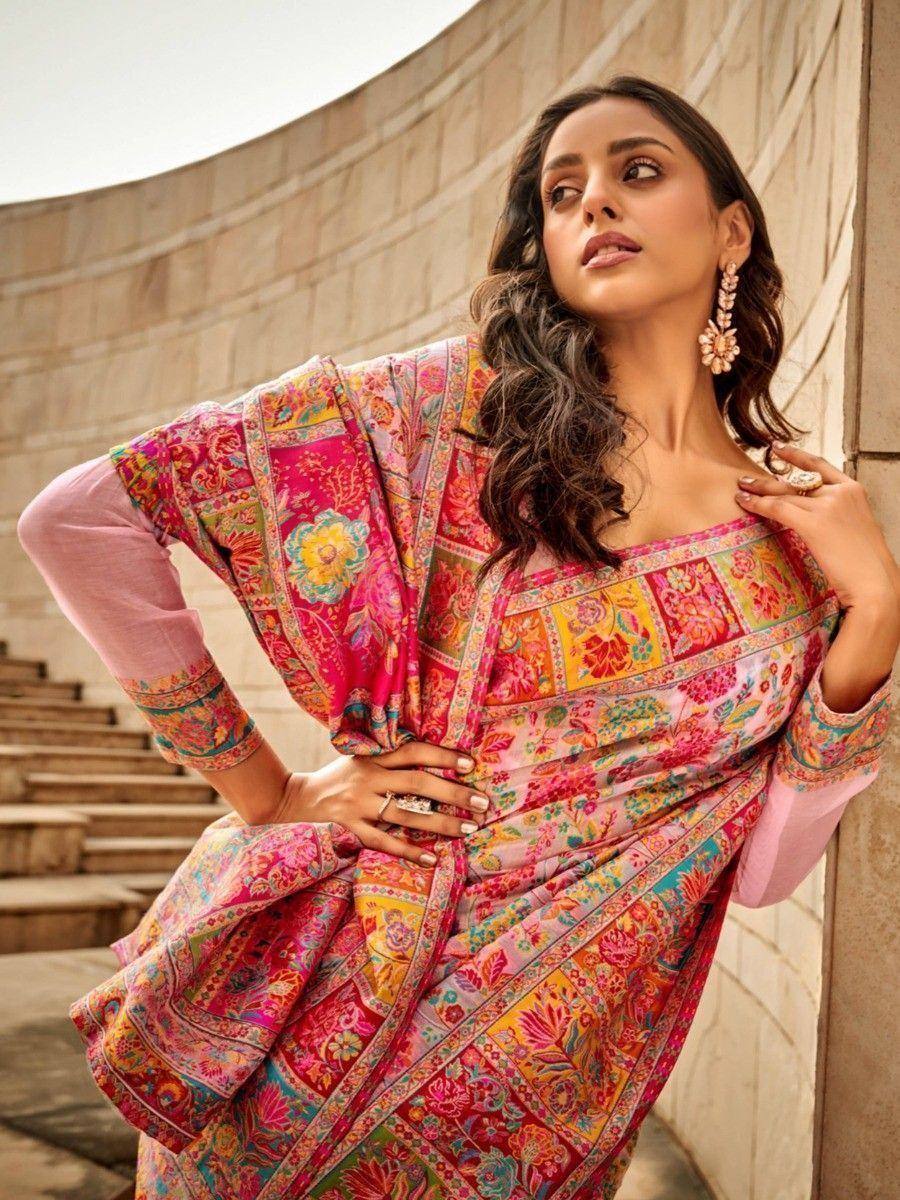 Vibrant floral printed Indian ethnic gown with pink sleeves, styled for festive occasions