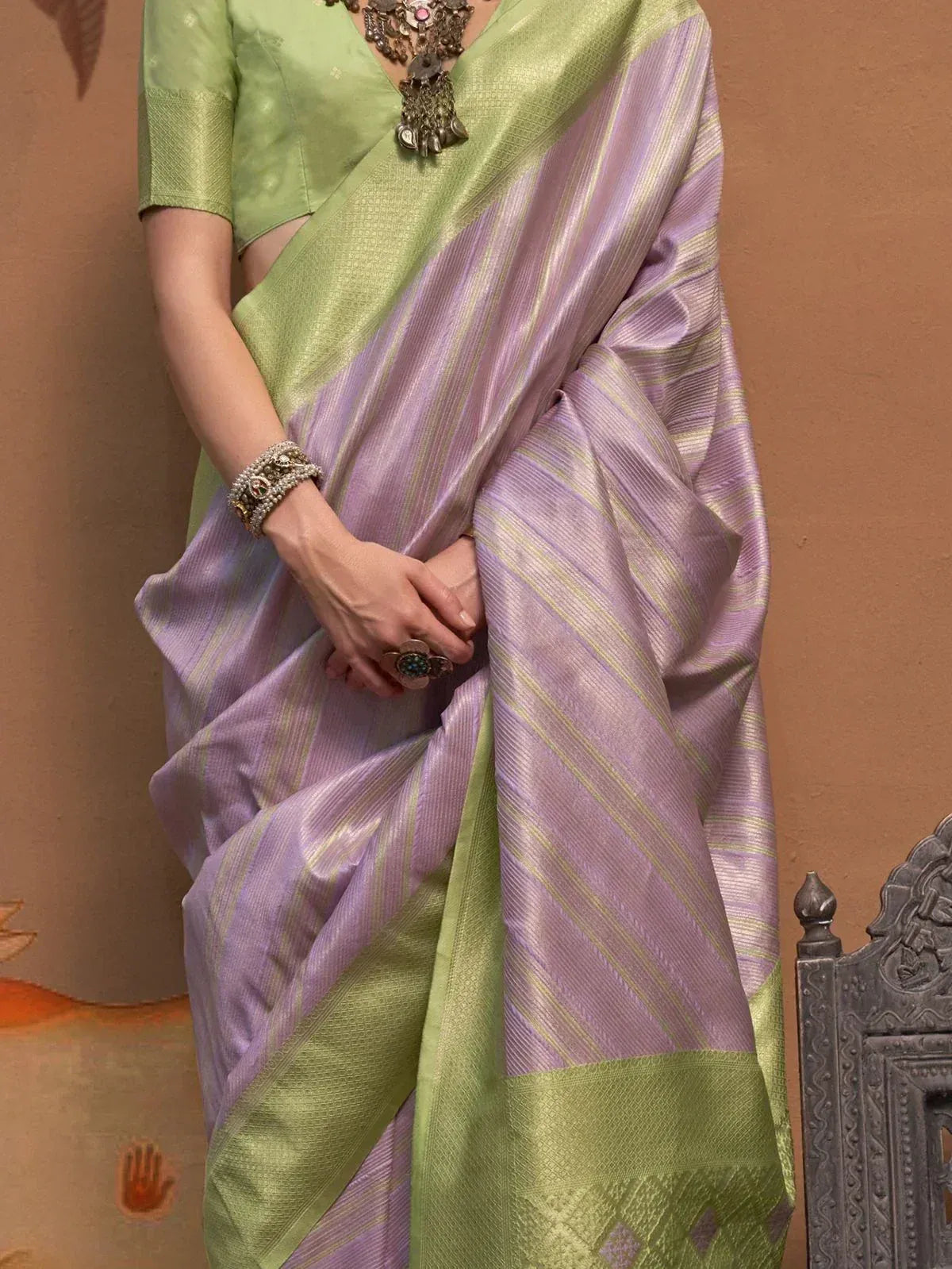 Elegant lavender and green striped saree with designer blouse, perfect for Indian ethnic wear