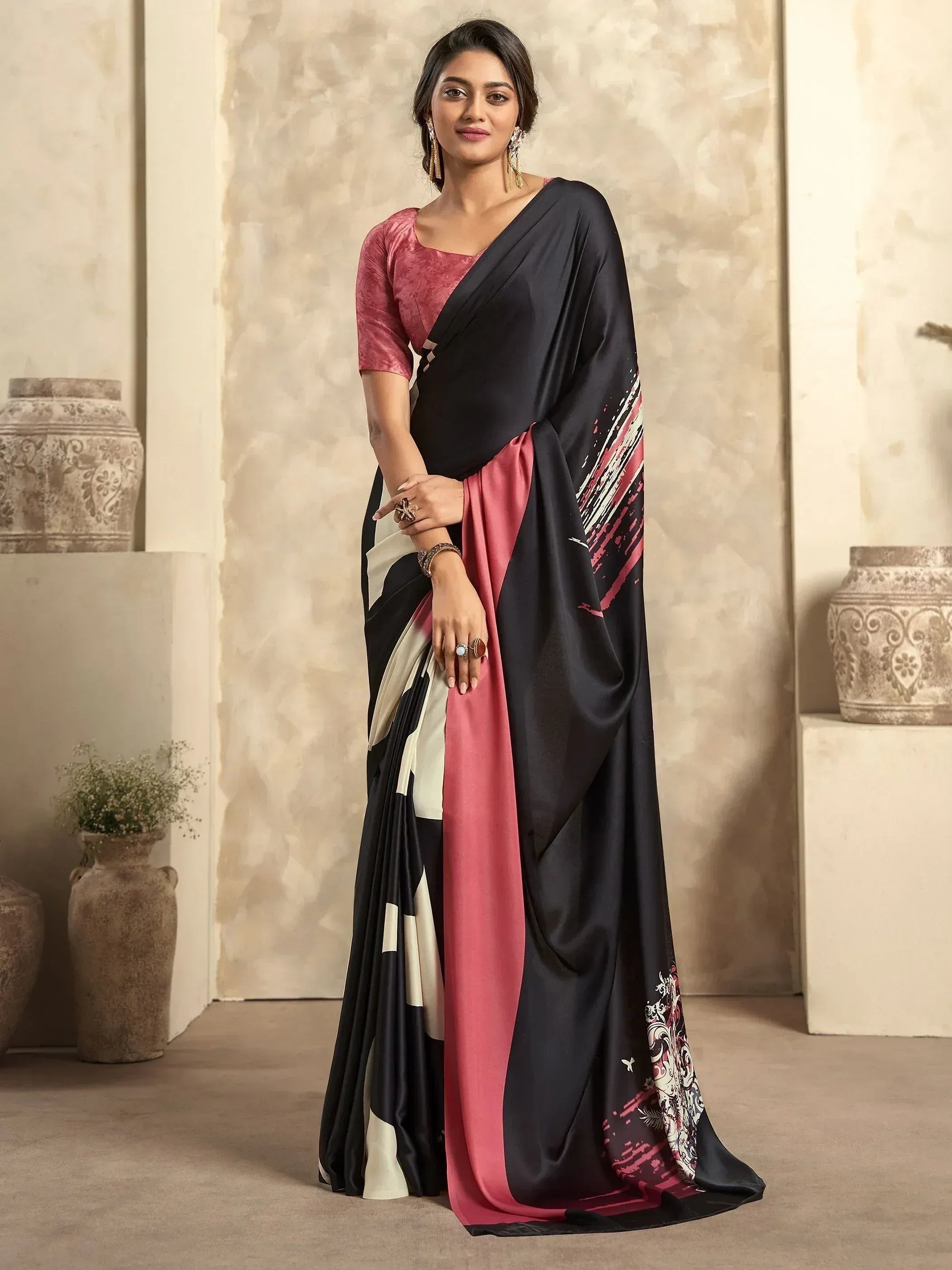 Black and pink designer saree with abstract print, paired with matching blouse, perfect for ethnic occasions