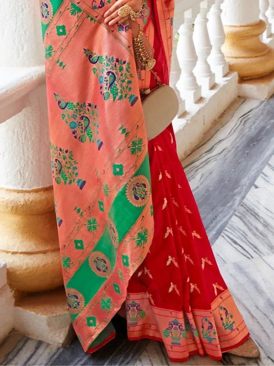 Vibrant Indian saree with peacock print, red blouse, and green border, styled for ethnic occasions