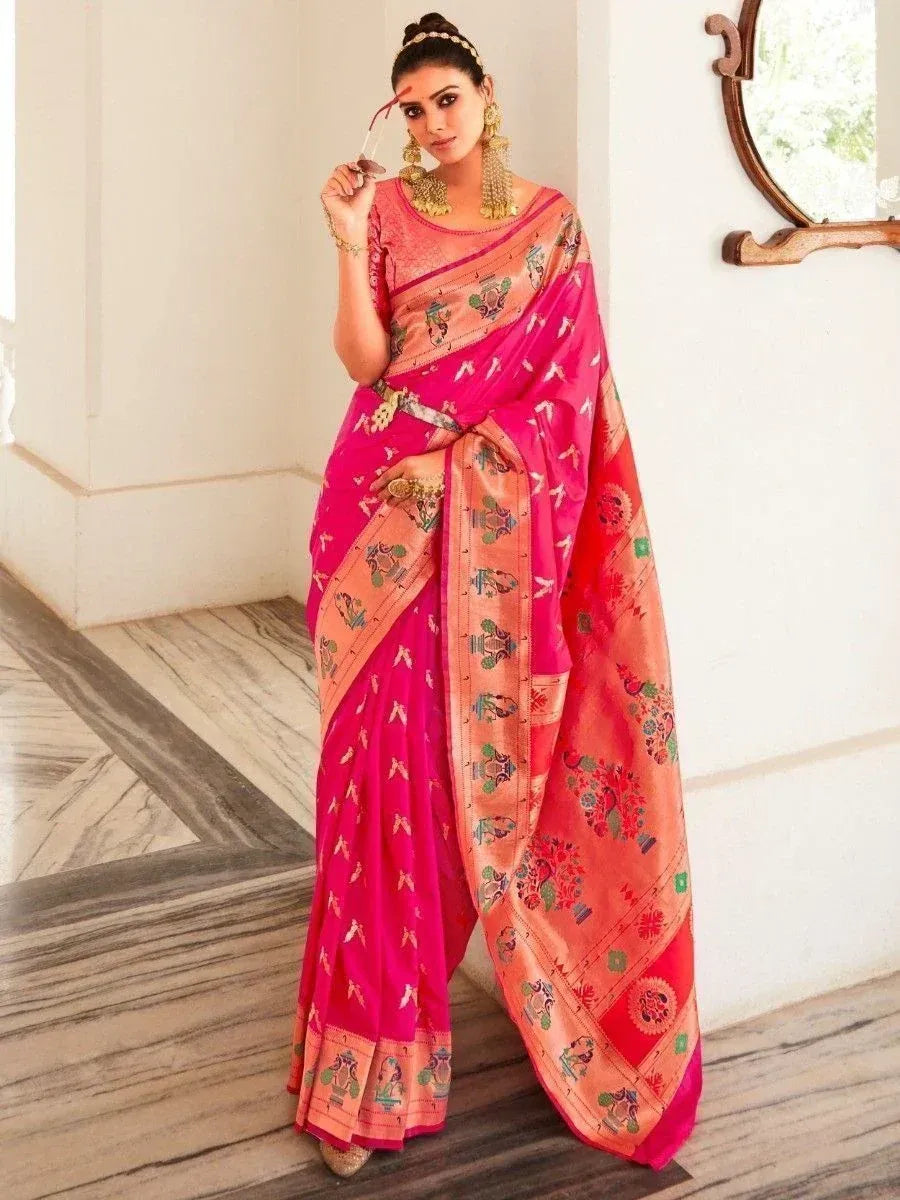 Pink and peach printed saree with traditional embroidery, styled with gold jewelry for ethnic occasions