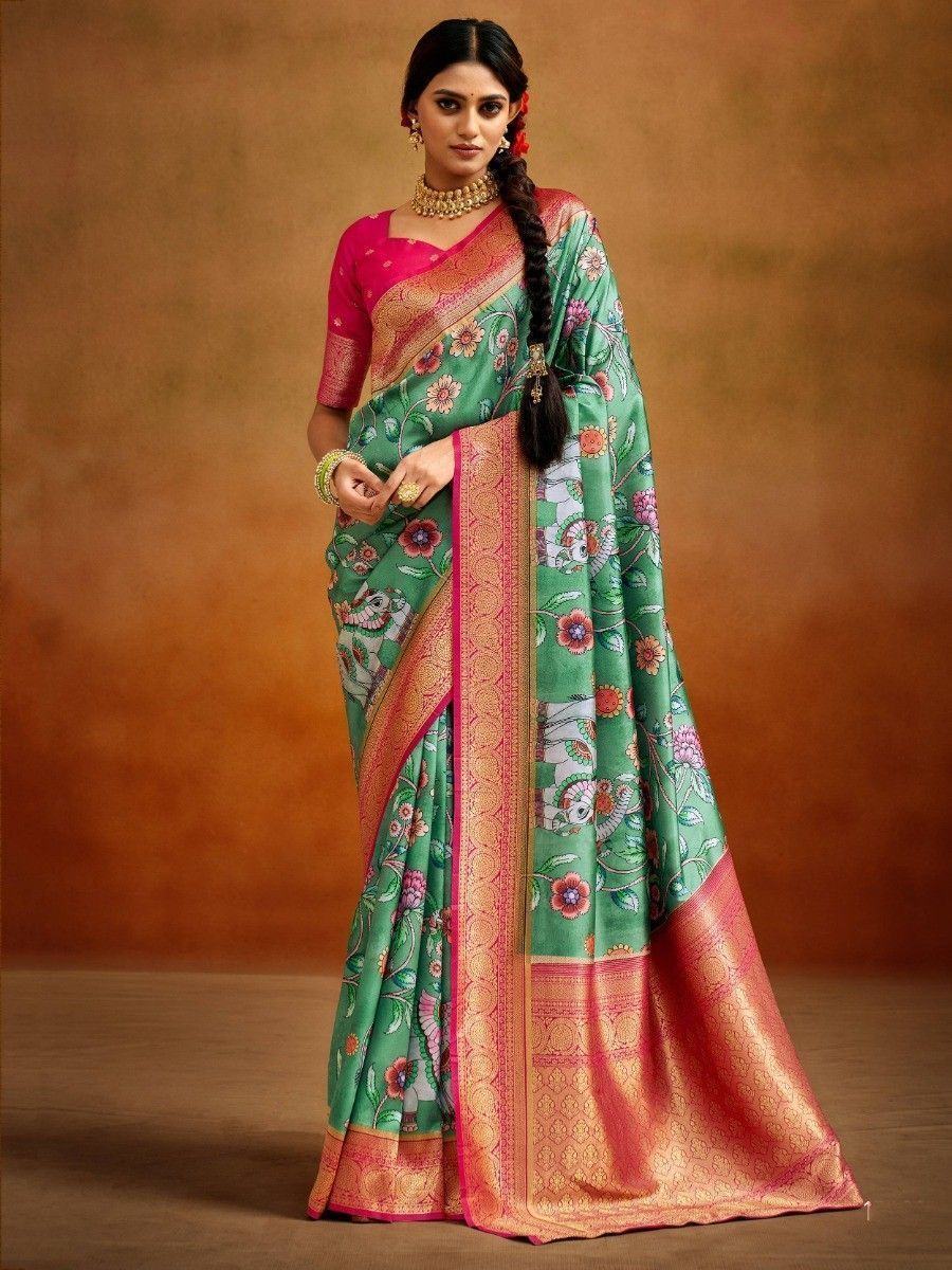 Green floral print saree with pink border, paired with matching blouse, perfect for ethnic occasions