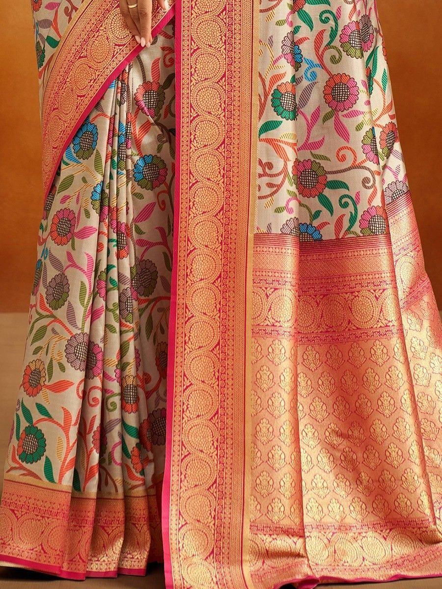 Colorful floral printed saree with intricate gold border, perfect for ethnic occasions