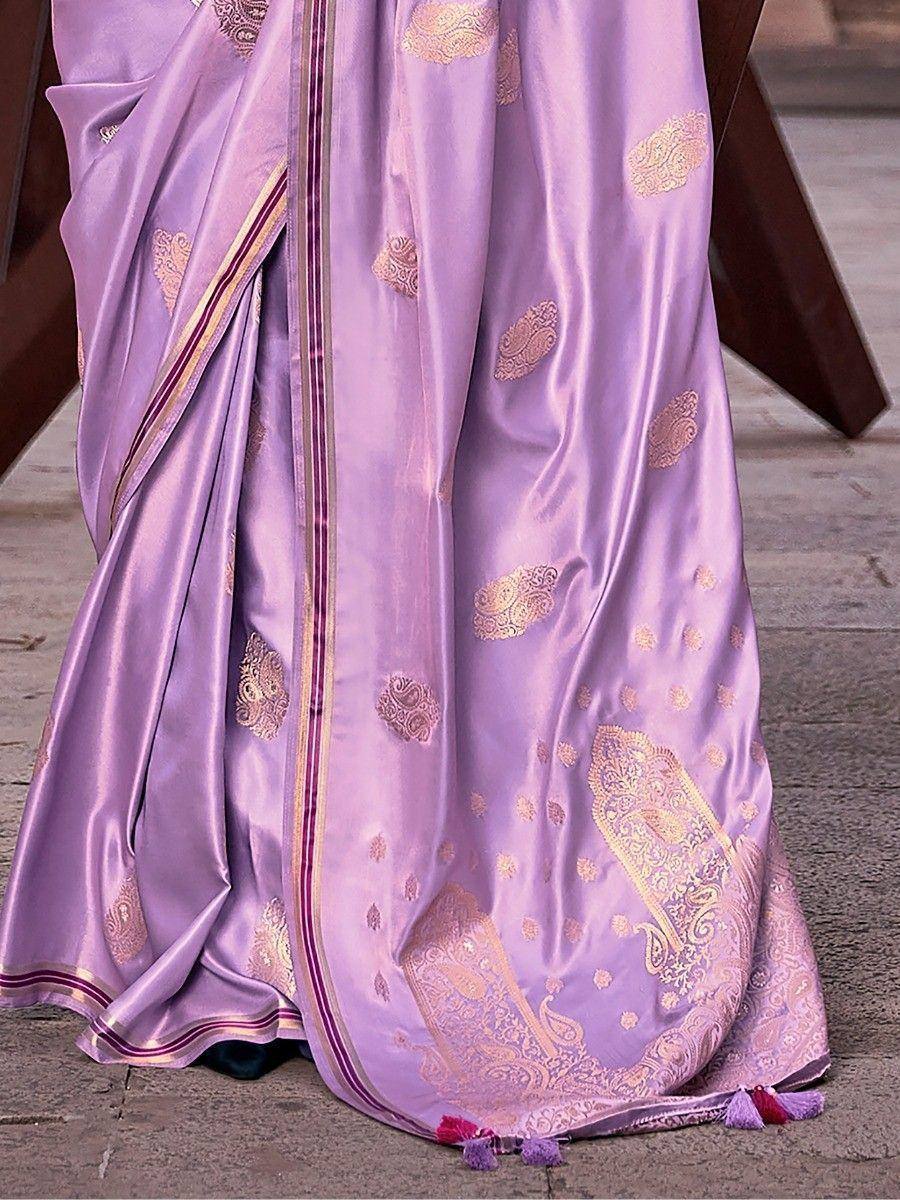 Lavender silk saree with gold paisley embroidery and tassels, elegant Indian ethnic wear