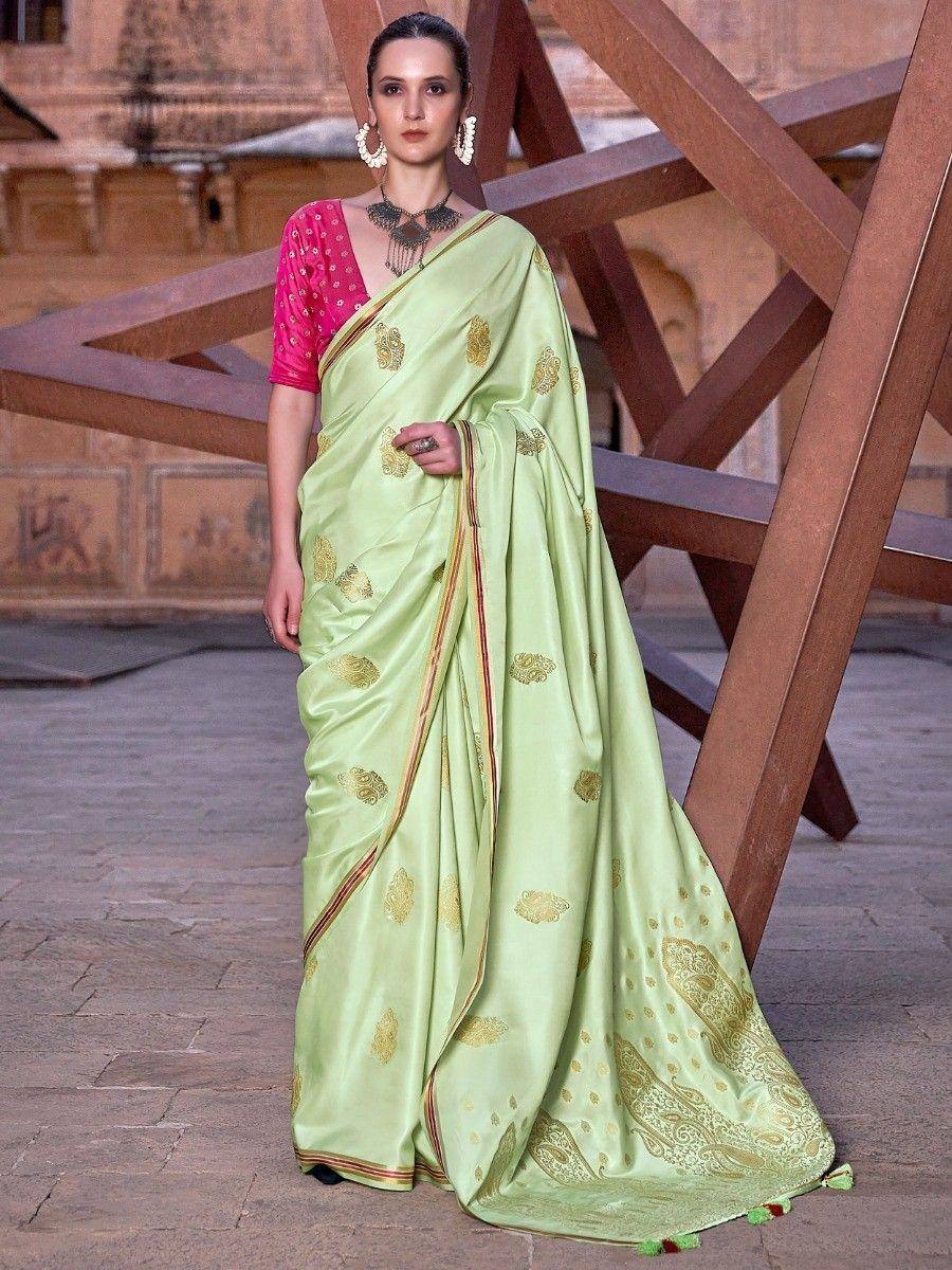 Light green silk saree with gold embroidery, paired with pink blouse, ideal for Indian ethnic wear occasions