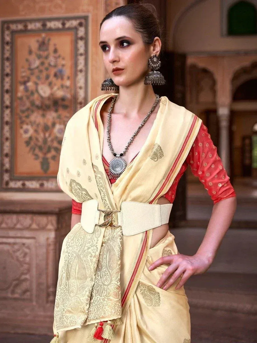 Elegant yellow saree with red blouse, gold embroidery, and statement belt for Indian ethnic wear