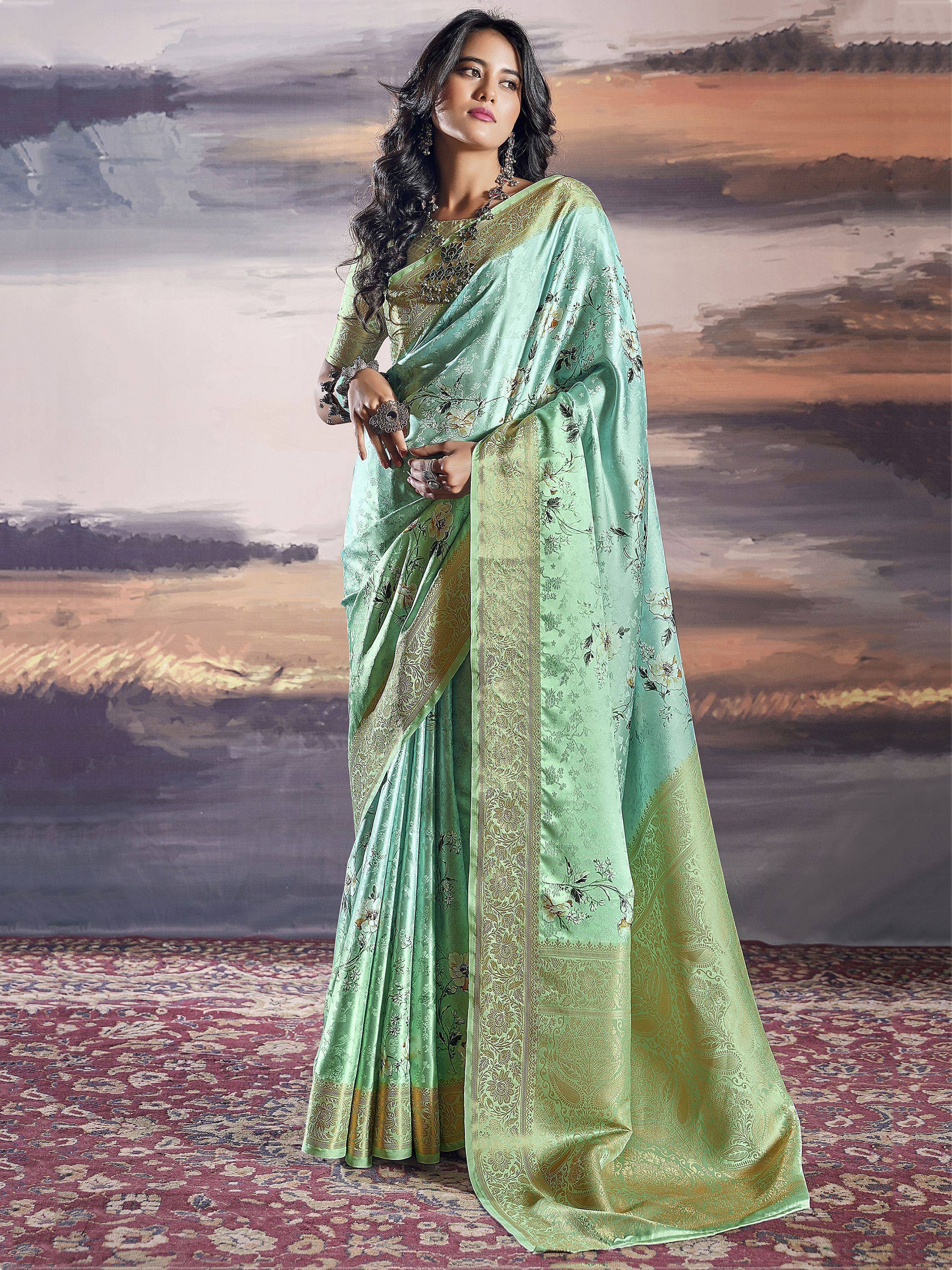 Mint green designer saree with gold floral embroidery and border, perfect for Indian ethnic occasions