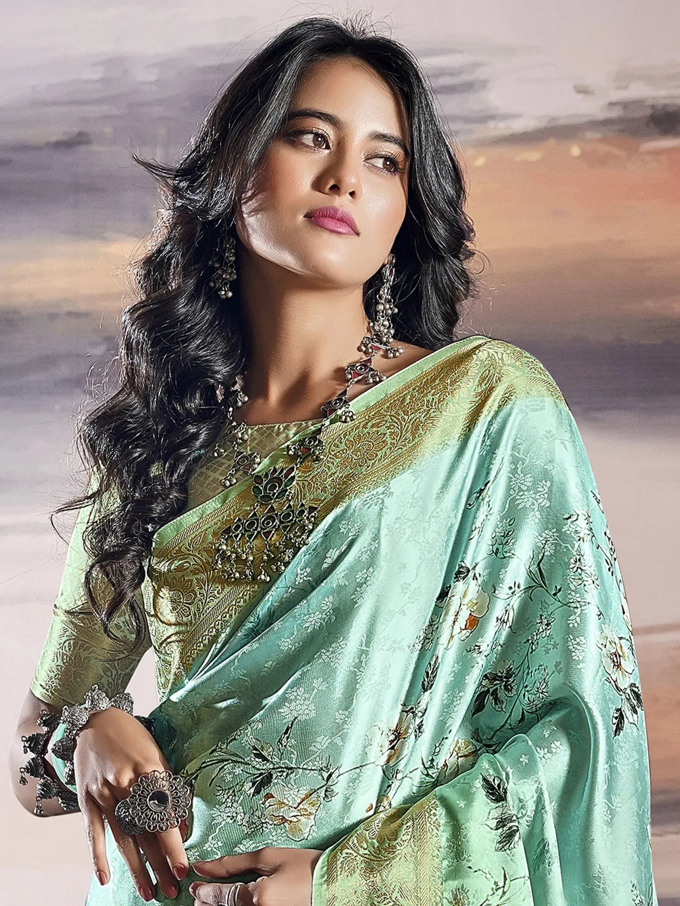 Elegant mint green floral saree with gold border, perfect for Indian ethnic wear occasions.