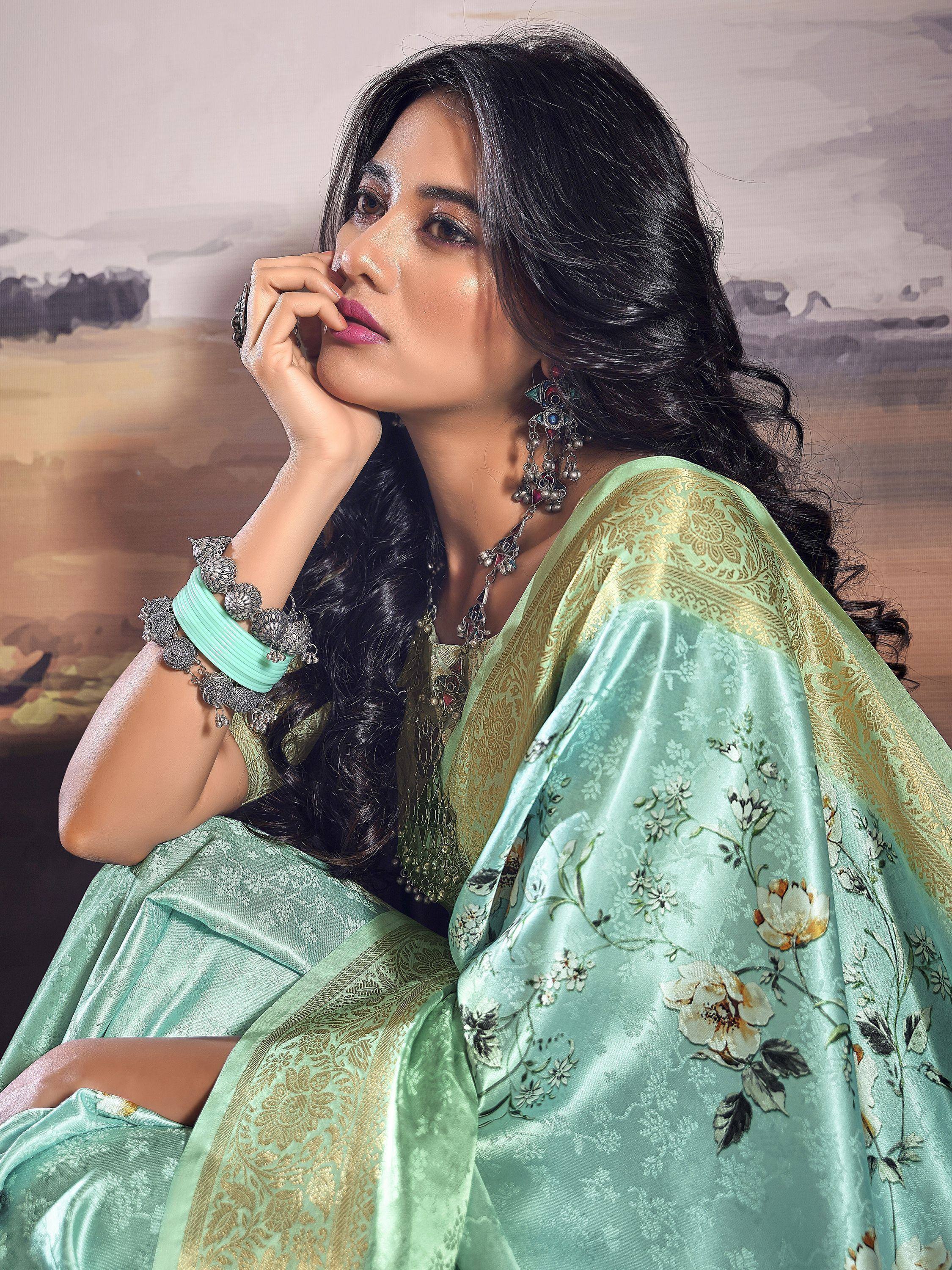 Mint green floral saree with gold border, traditional Indian ethnic wear, paired with statement jewelry