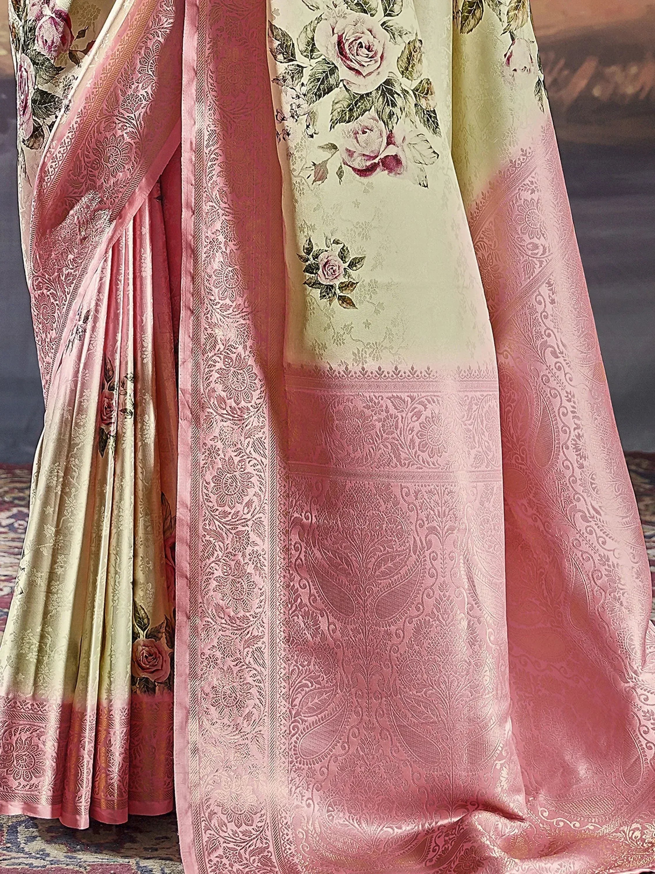 Elegant pink and cream floral saree with intricate paisley border, perfect for Indian ethnic wear occasions.