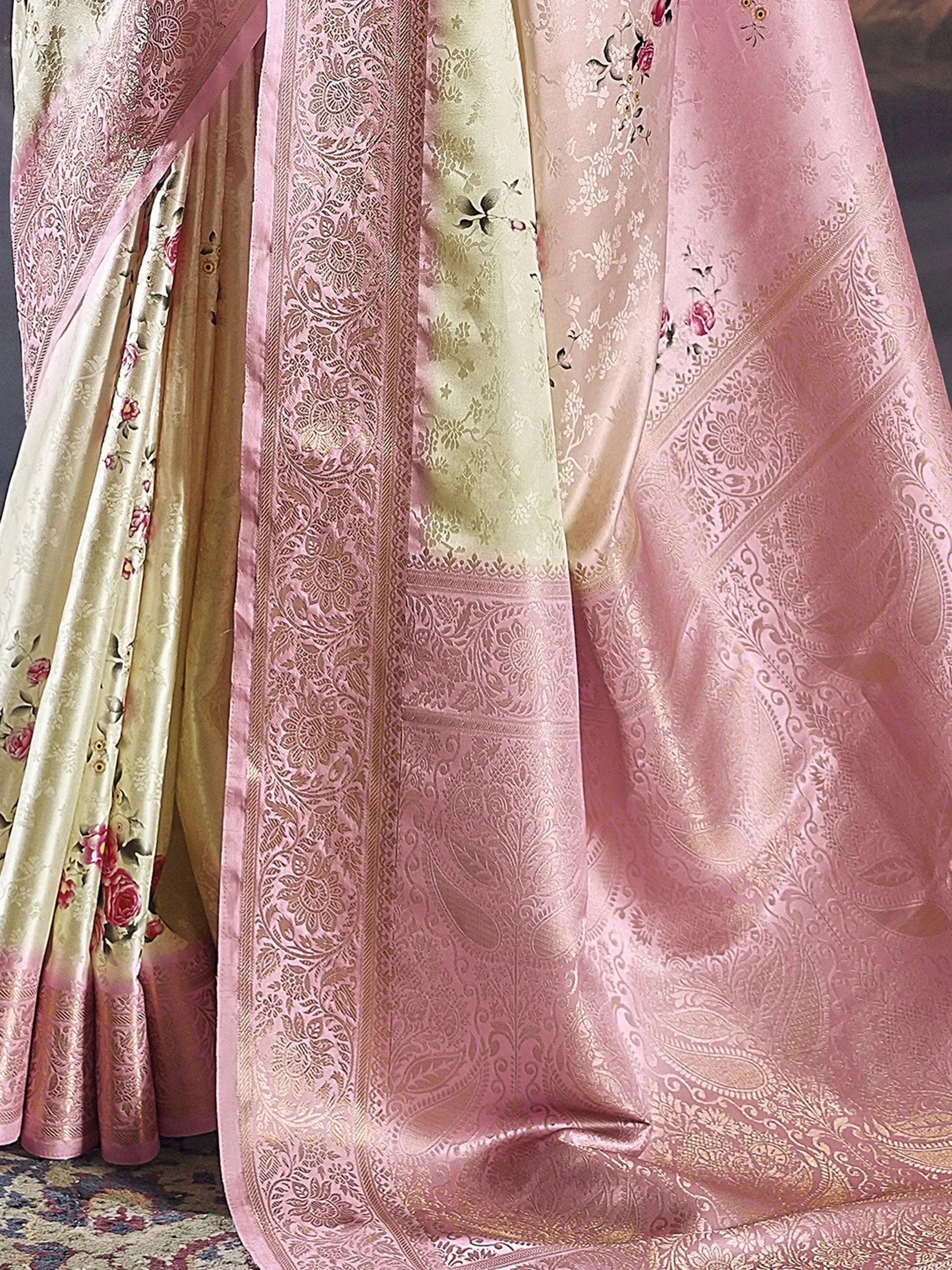 Pink and gold designer saree with intricate floral and paisley embroidery, perfect for ethnic wear.