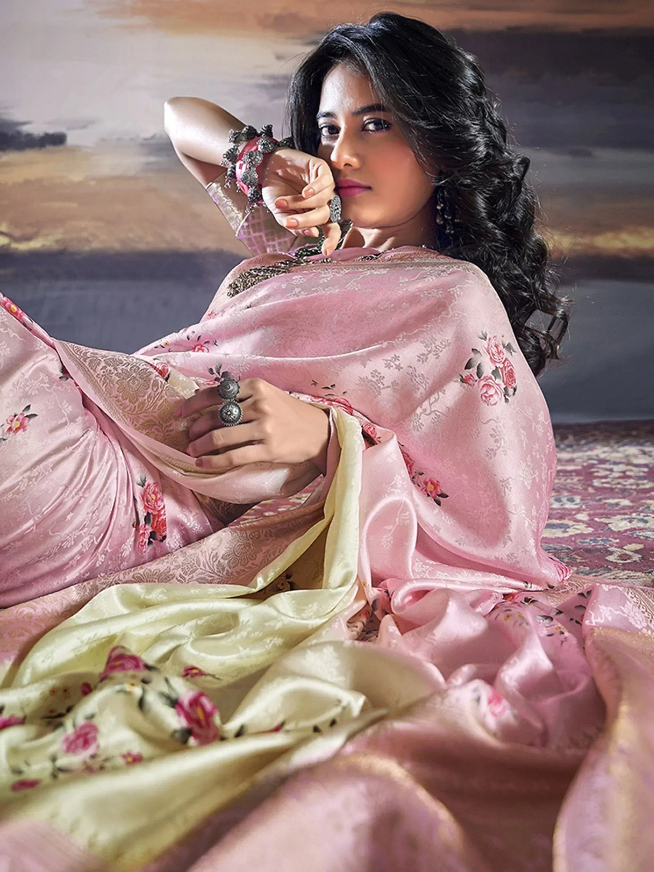Woman in elegant pink floral saree with gold border, styled for Indian ethnic wear occasions