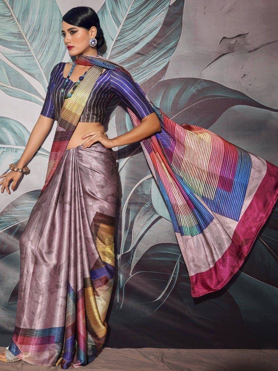 Woman in colorful striped saree with purple blouse, ethnic Indian wear, stylish designer look