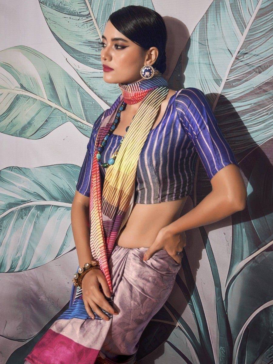 Woman in striped blue crop top and pink skirt with colorful scarf, ethnic wear fashion