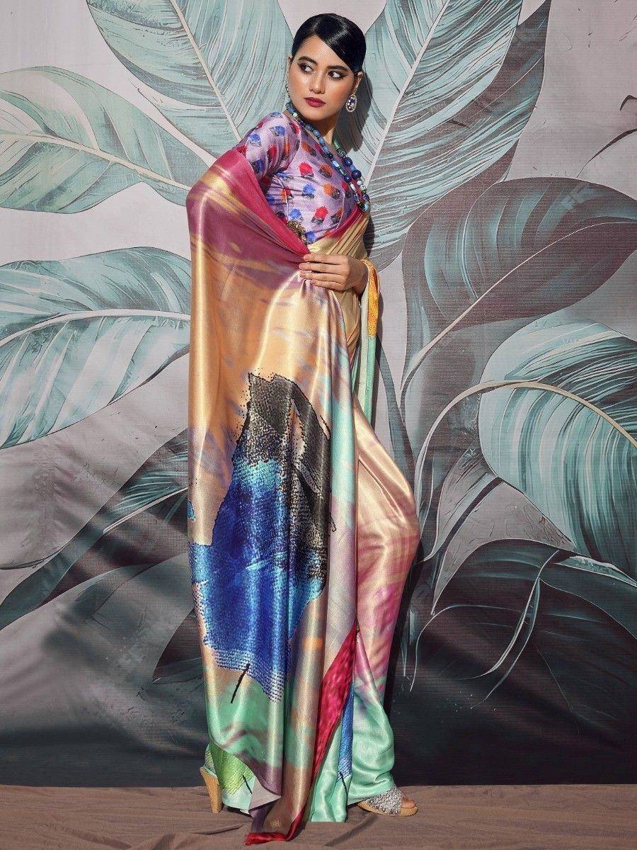 Woman in colorful printed saree with abstract design, styled with blouse and statement jewelry