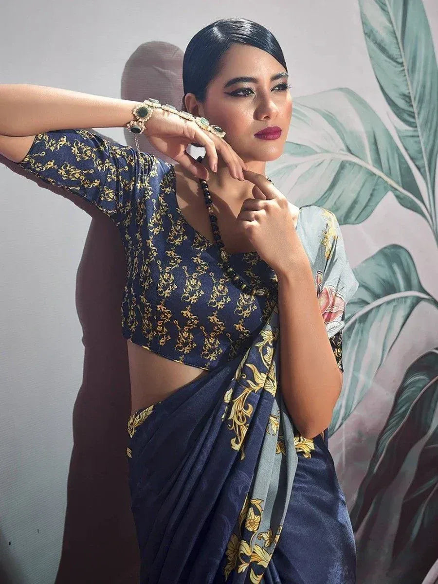 Woman in navy blue and gold printed saree with matching blouse, elegant ethnic wear for festive occasions