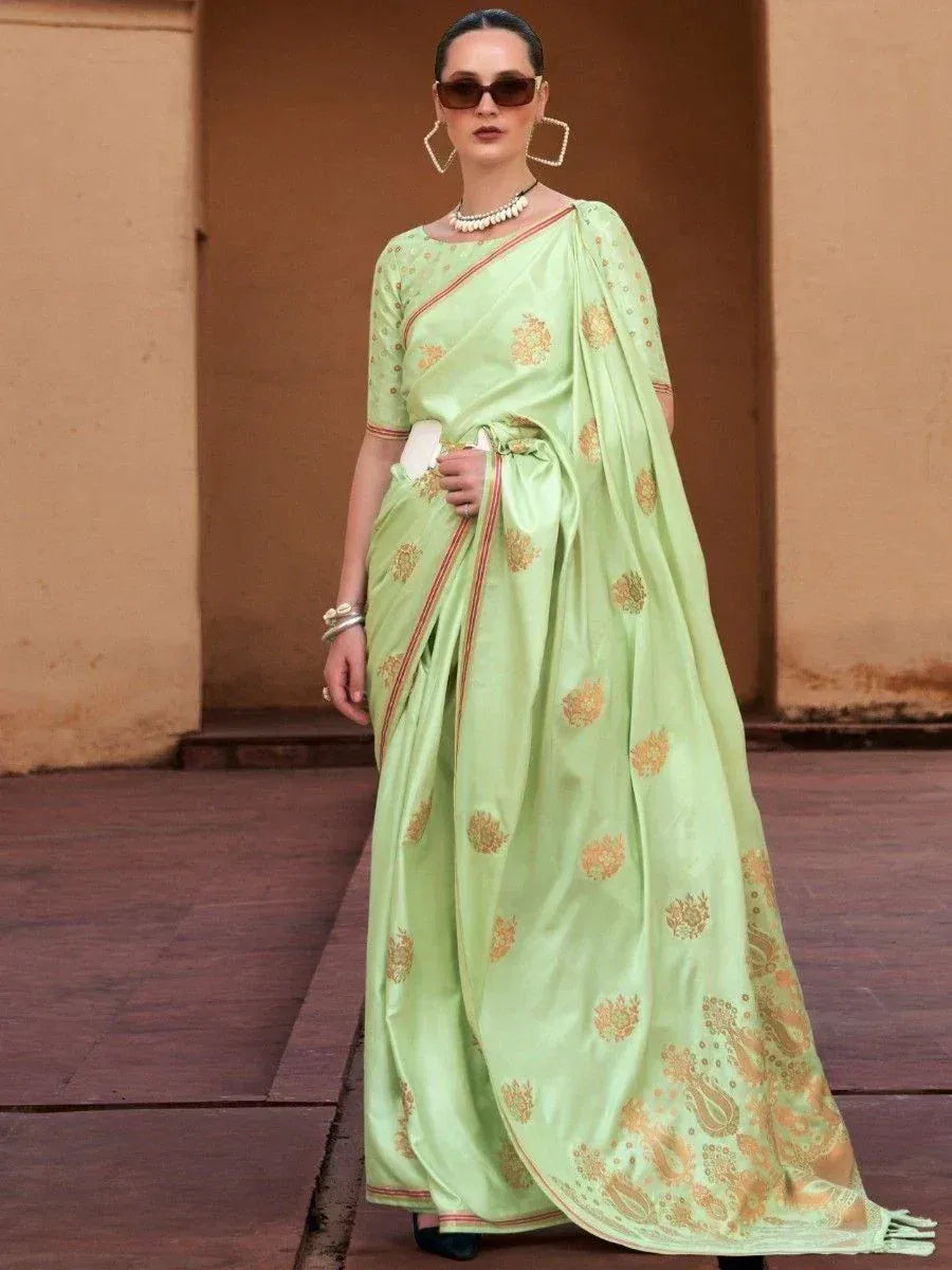 Light green designer saree with gold floral motifs, perfect for ethnic occasions