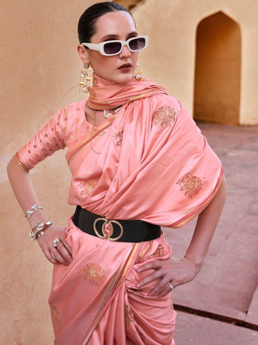 Pink floral saree with gold border, styled with black belt and white sunglasses for modern ethnic look