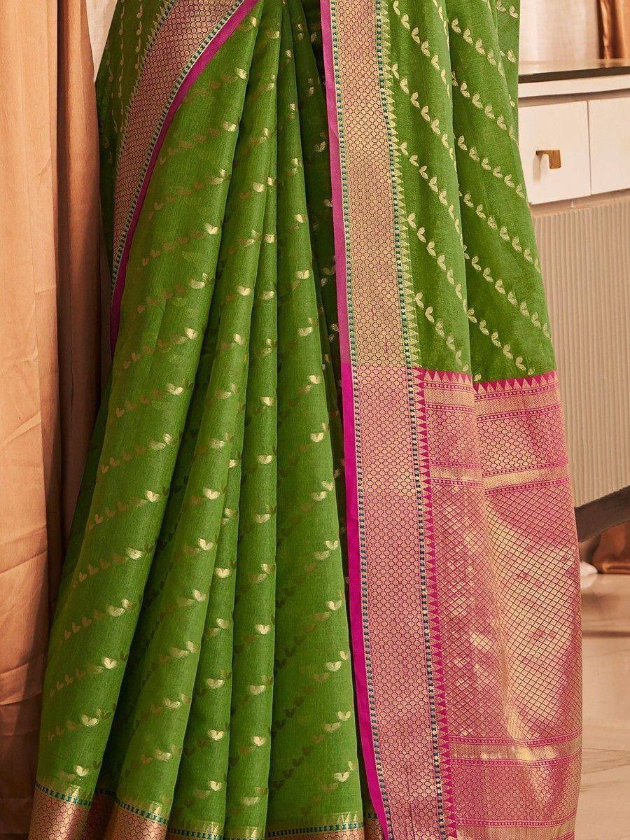 Green designer saree with gold leaf print and pink border, ethnic wear for women