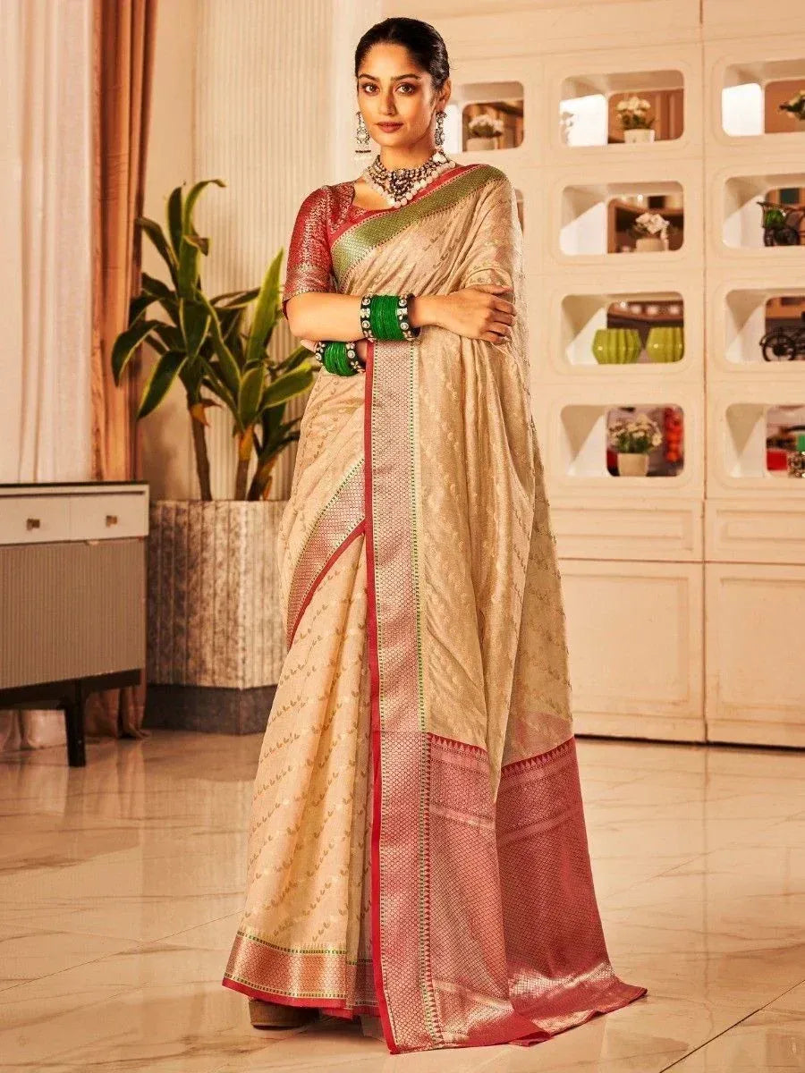 Elegant beige and red designer saree with green border, perfect for Indian ethnic occasions