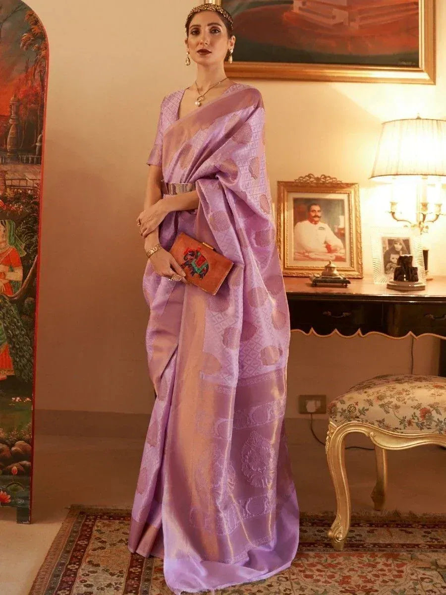 Elegant lavender designer saree with intricate patterns, perfect for Indian ethnic wear occasions.