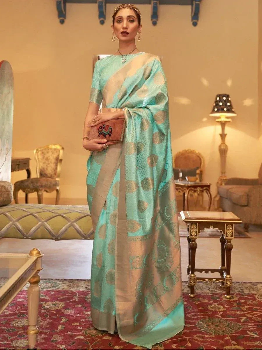 Turquoise designer saree with gold motifs, perfect for Indian ethnic occasions
