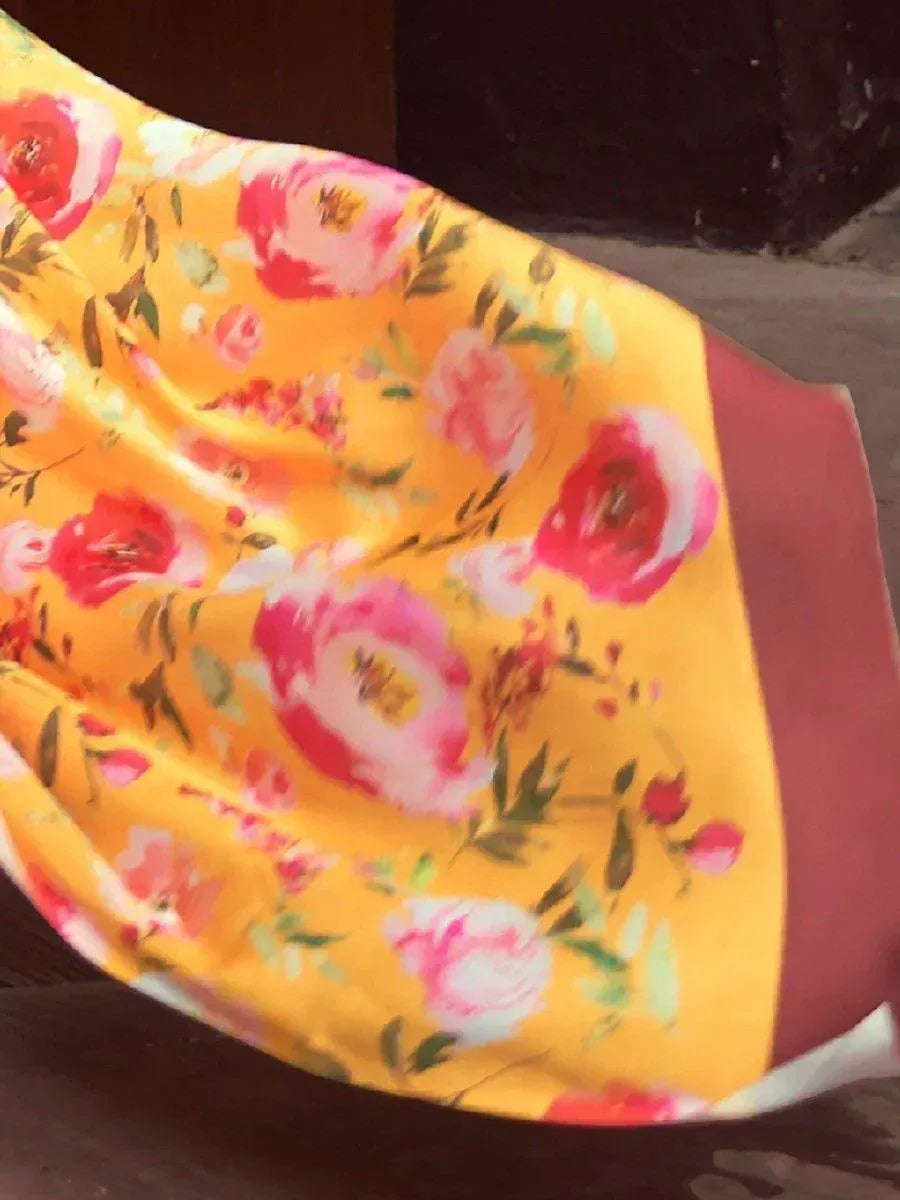 Yellow floral saree with pink roses, perfect for ethnic wear and Indian occasions