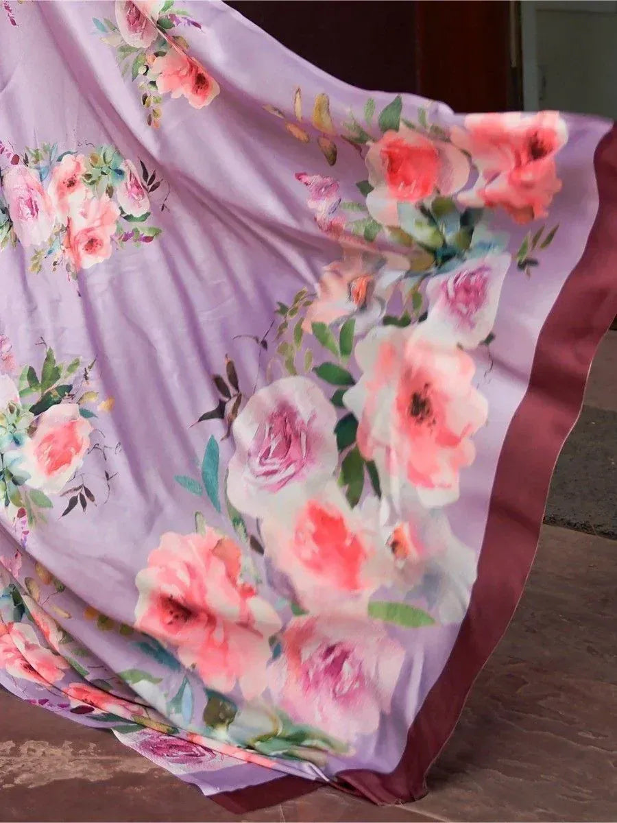 Lavender floral print ethnic gown with pink roses and green leaves, flowing fabric design