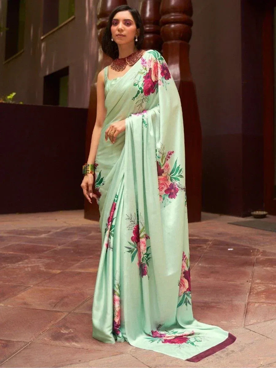 Mint green floral saree with vibrant rose print, elegant ethnic wear for women