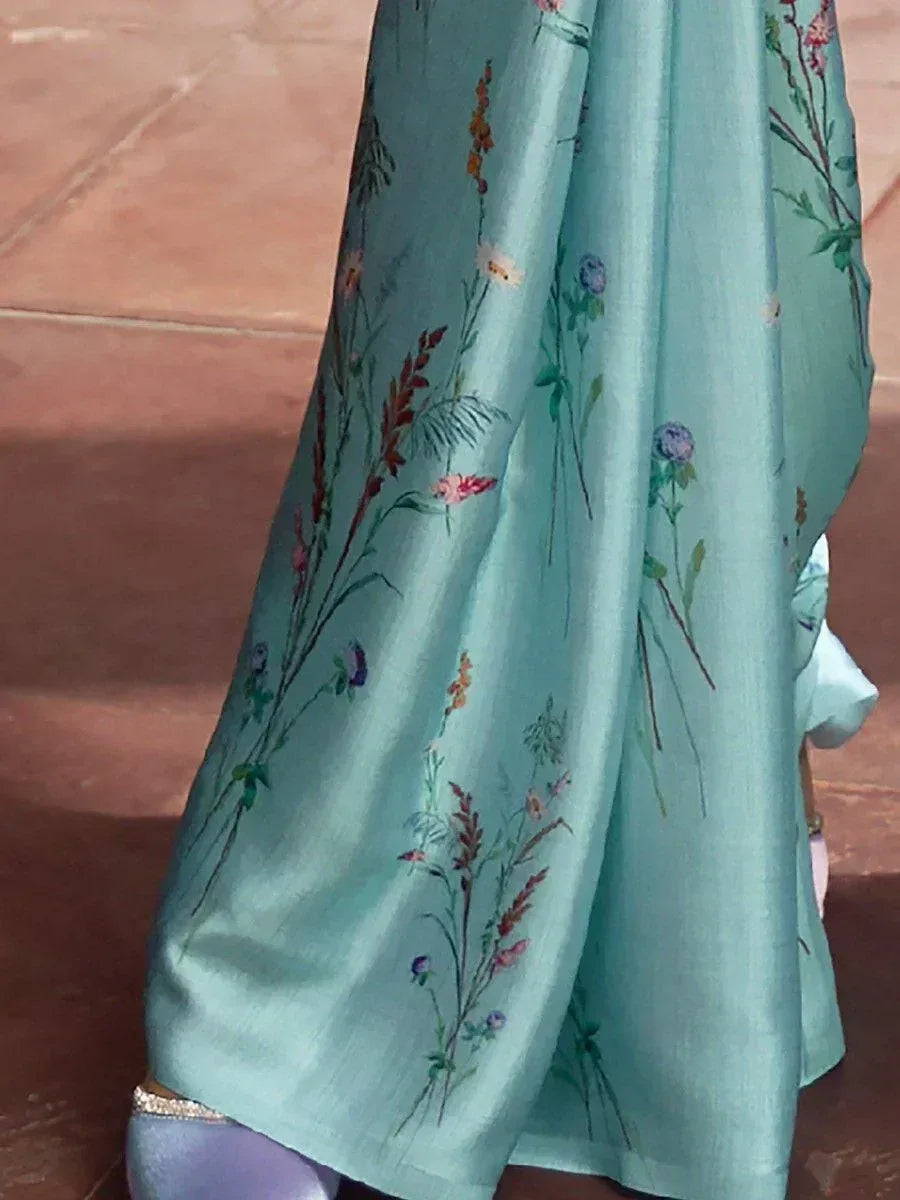 Light blue floral printed ethnic gown with delicate botanical embroidery, perfect for Indian occasions.
