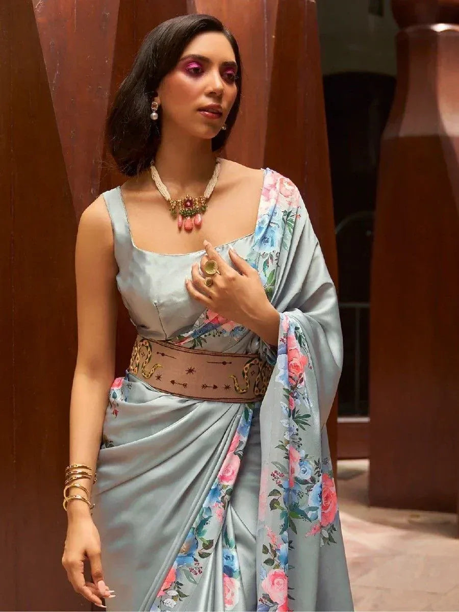 Elegant light blue floral saree with embroidered belt, perfect for Indian ethnic occasions