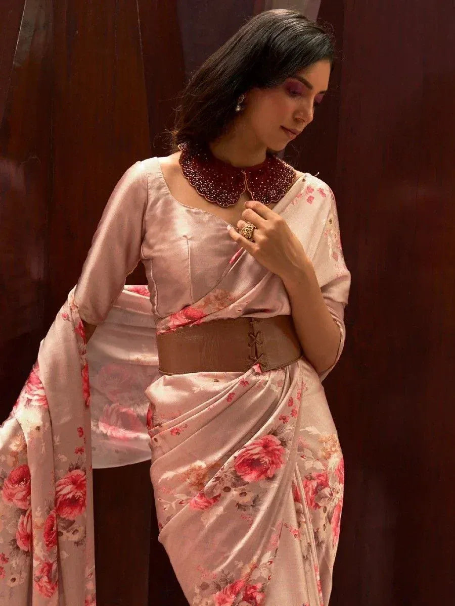 Pink floral saree with embellished collar and waist belt, styled for ethnic occasions