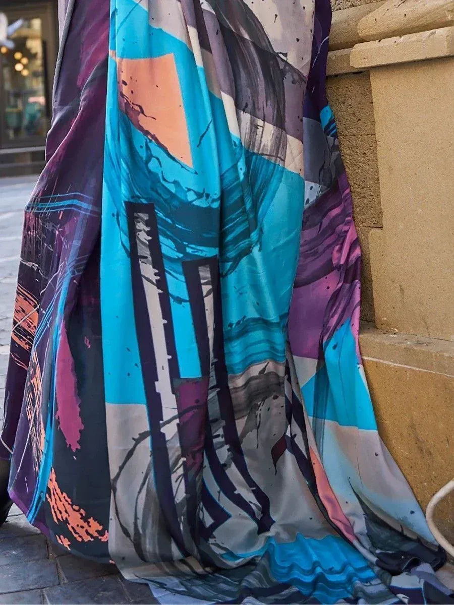 Vibrant abstract print ethnic gown in teal, purple, and orange hues, perfect for modern Indian wear.