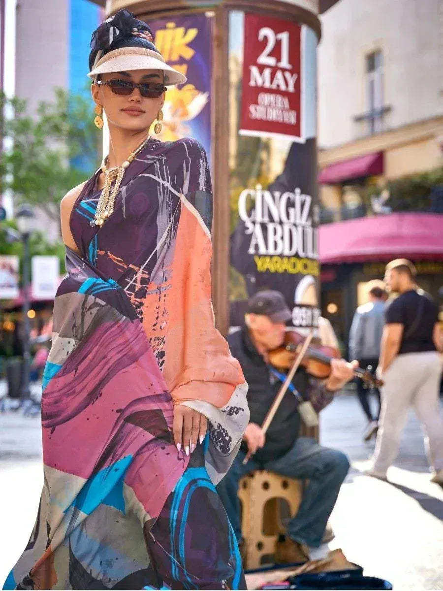 Woman in vibrant abstract print ethnic gown, stylish streetwear, sunglasses, and hat for modern Indian fashion.