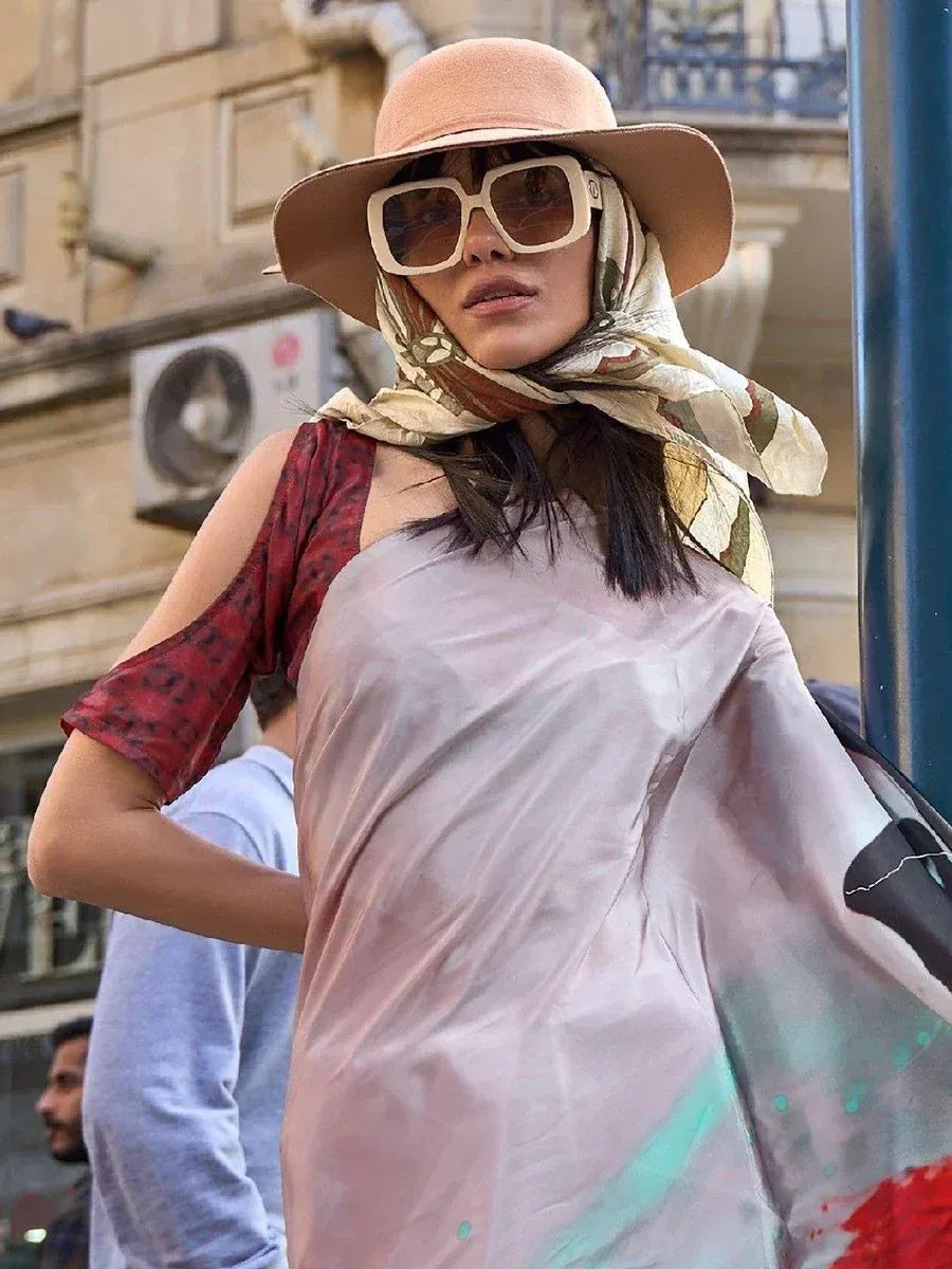 Woman in stylish ethnic gown with scarf, hat, and sunglasses for street fashion