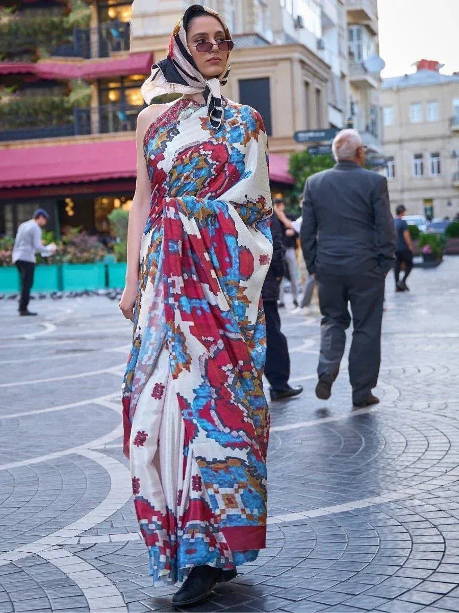 Woman in vibrant printed ethnic gown with matching headscarf, walking on city street
